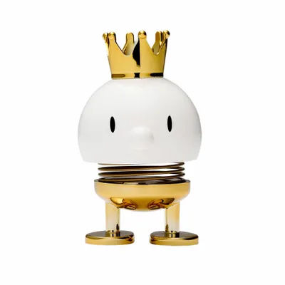 A white and gold bobblehead figure with a crown.
