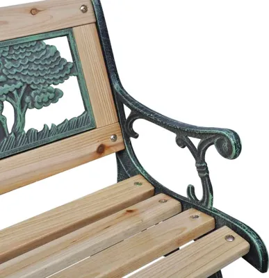 Close-up of a garden bench with wooden slats and cast iron armrests featuring a tree motif.