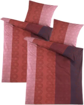 Two folded duvet covers and pillowcases with a striped pattern.