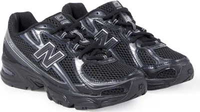 A pair of black New Balance athletic shoes.