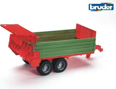 A toy trailer with a green cargo bed and red frame, shown from a side-angle on a white background.