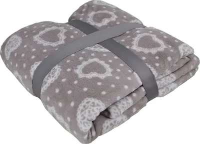 A folded gray fleece blanket with a white heart pattern, held together by a gray strap.
