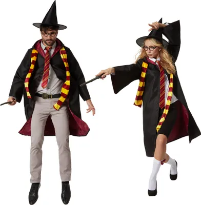 Two people dressed as wizards, one male and one female, posing with wands.