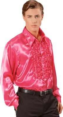 A man wearing a pink ruffled shirt and black pants.