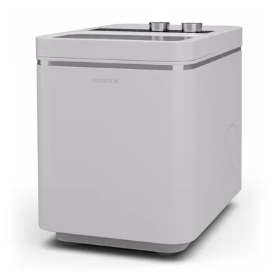 A white ice maker on a white background.