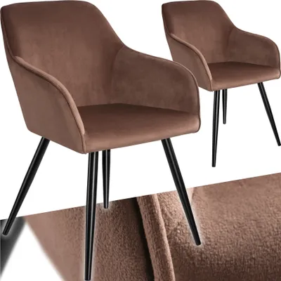 Two brown velvet-look dining chairs with black legs are shown against a white background. A close-up texture of the velvet fabric is visible at the bottom.