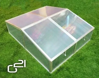 A greenhouse on a lawn.