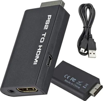 A black PS2 to HDMI adapter with a USB cable and a second adapter in the background.