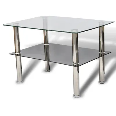 A glass coffee table with a lower shelf and chrome legs, presented on a white background.