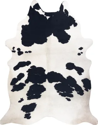 A cowhide rug with black and white markings.