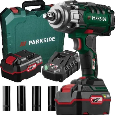 A cordless impact wrench kit with two batteries, a charger, and sockets, displayed on a white background.