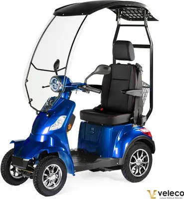 Produktbild von Veleco Faster Seniorenmobil mit Dach und Kapitänssitz - Windschutzscheibe - Hohe Rückenlehne - 4 Rad Elektromobil - Mobilitätsroller - 1000W (Blau)