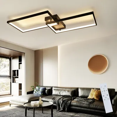 A modern living room with a sectional sofa, coffee table, and a stylish ceiling light.