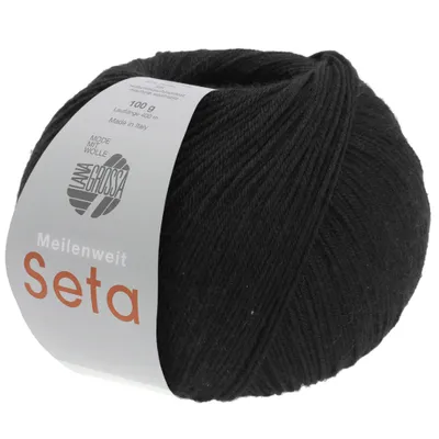 A ball of black yarn with a label.