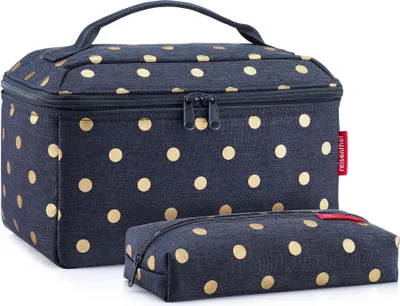 A blue cosmetic bag with gold polka dots and a smaller matching pouch.