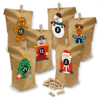 A collection of brown paper bags decorated with Christmas characters and numbers, clipped to a surface with wooden clothespins. A pile of clothespins is in the foreground.