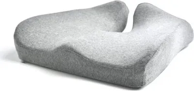 A gray ergonomic seat cushion with a U-shaped cutout.