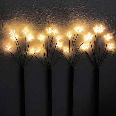 Produktbild von 4 Stück LED-Gartenleuchtstäbe mit 24 Sternen warm-weiß Batteriebetrieben