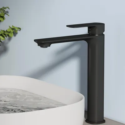 A black faucet is shown over a white sink filled with water.