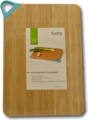 A bamboo cutting board with a label showing a picture of vegetables and text.