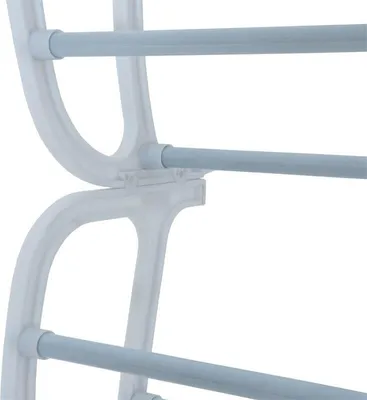 Close-up of a white shoe rack with light gray shelves.