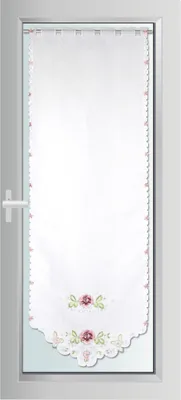 A white door curtain with floral embroidery.