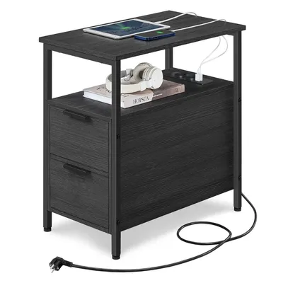 A black side table with two drawers and a built-in power strip, shown on a white background.