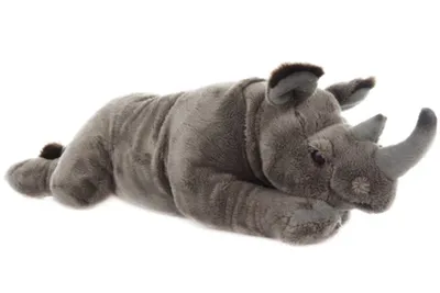 A plush toy rhinoceros lying down on a white background.