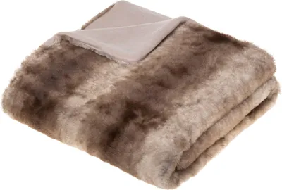 A folded faux fur blanket with a beige lining.