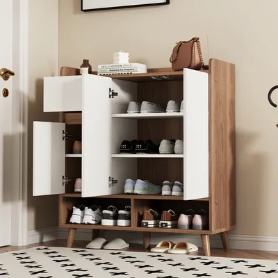 A shoe cabinet with various shoes and accessories displayed inside and on top.