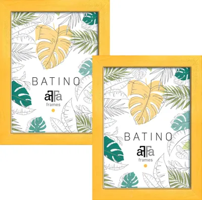 Two yellow picture frames with a tropical leaf pattern inside.