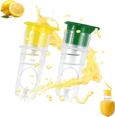 Two manual lemon juicers with yellow and green caps, with lemon juice splashing around them, and a whole lemon with a juicer inserted in the bottom right corner.