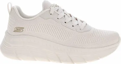 A side view of a white Skechers sneaker against a white background.