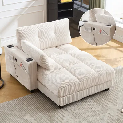 A beige corduroy chaise lounge with built-in cup holders and storage pockets is shown in a room.