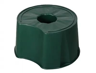 A green plastic stand for a rain barrel.