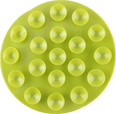 A green suction mat with multiple raised bumps, shown from a top-down perspective against a white background.