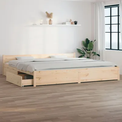 A wooden bed frame with drawers in a room with a white wall and wooden floor.