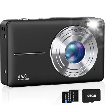 A black digital camera with silver accents is shown on a white background, with accessories like batteries and a memory card displayed in the foreground.