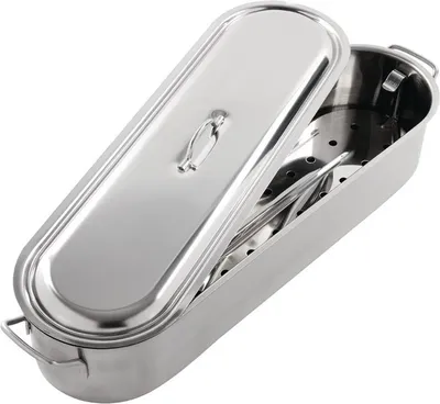 A stainless steel fish poacher with its lid slightly ajar, revealing a perforated rack inside.