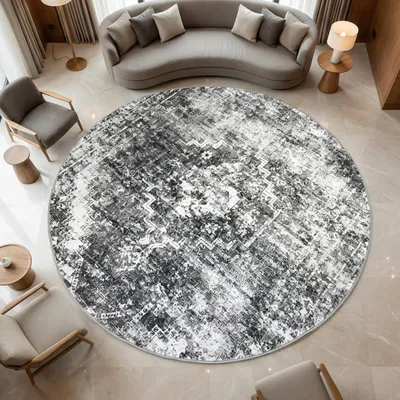 Productafbeelding van Grijze vloerkleed met medaillon, geschikt voor diverse moderne woonruimtes. Afmetingen: 80 cm diameter