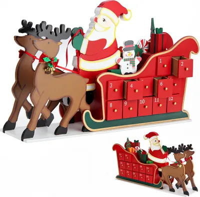 A wooden Christmas advent calendar shaped like Santa's sleigh pulled by reindeer, with numbered drawers.