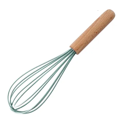 A kitchen whisk with a wooden handle and green silicone wires is shown against a white background.