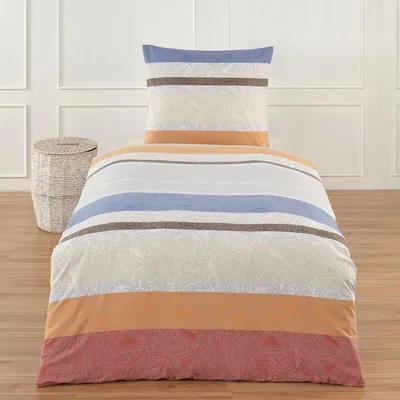 A bedding set with a pillow and duvet cover is displayed on a bed in a room.