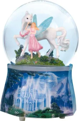 A snow globe with a figurine of a girl and a Pegasus inside, set on a decorative base depicting a castle.