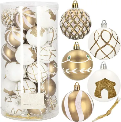 A collection of gold and white Christmas ornaments in a clear plastic container and arranged around it.