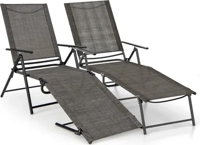 Two dark gray folding lounge chairs are shown against a white background.