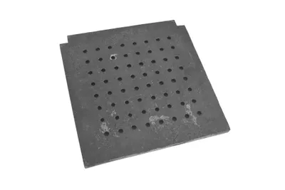 A square metal grate with many small holes, placed on a white background.