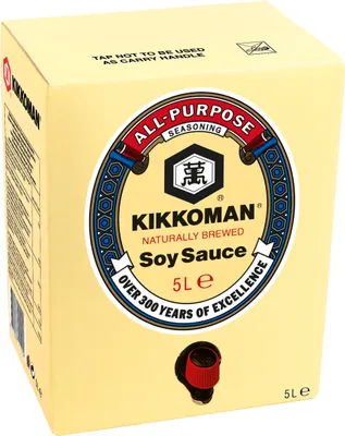 A large beige box of Kikkoman Soy Sauce with a dispensing tap.