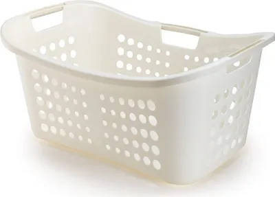 A cream-colored laundry basket with holes.