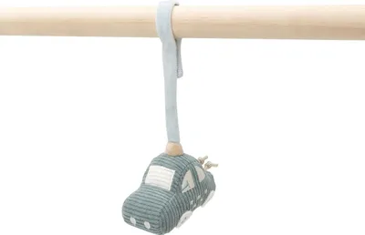 A toy car hanging from a wooden bar.